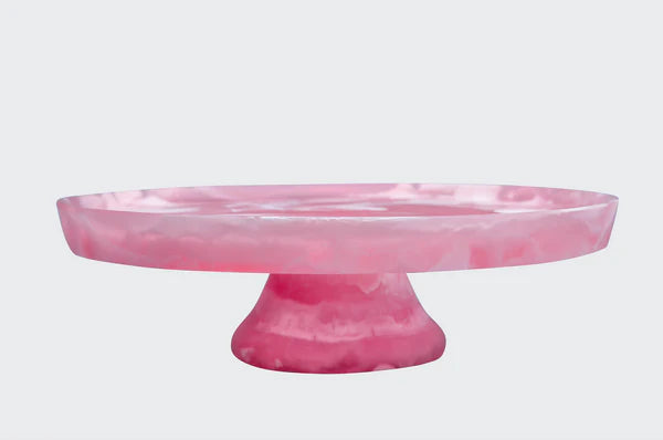 Pink marble cake stand on a white background